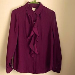 Chico’s plum colored button up blouse with ruffled front.